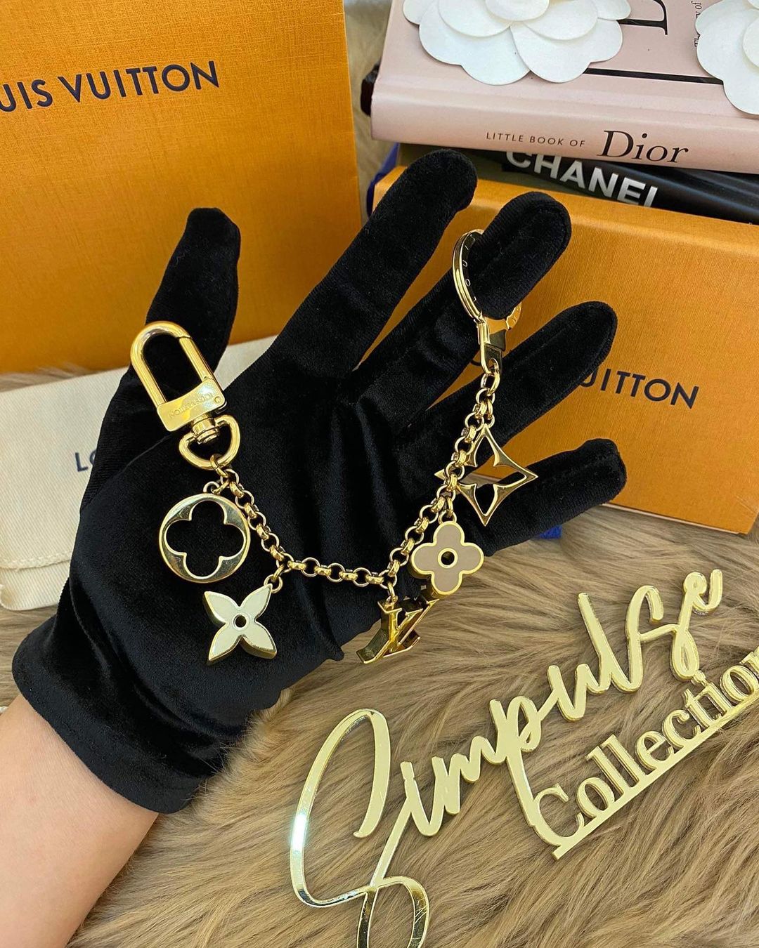 L V Fleur de monogram bag charm