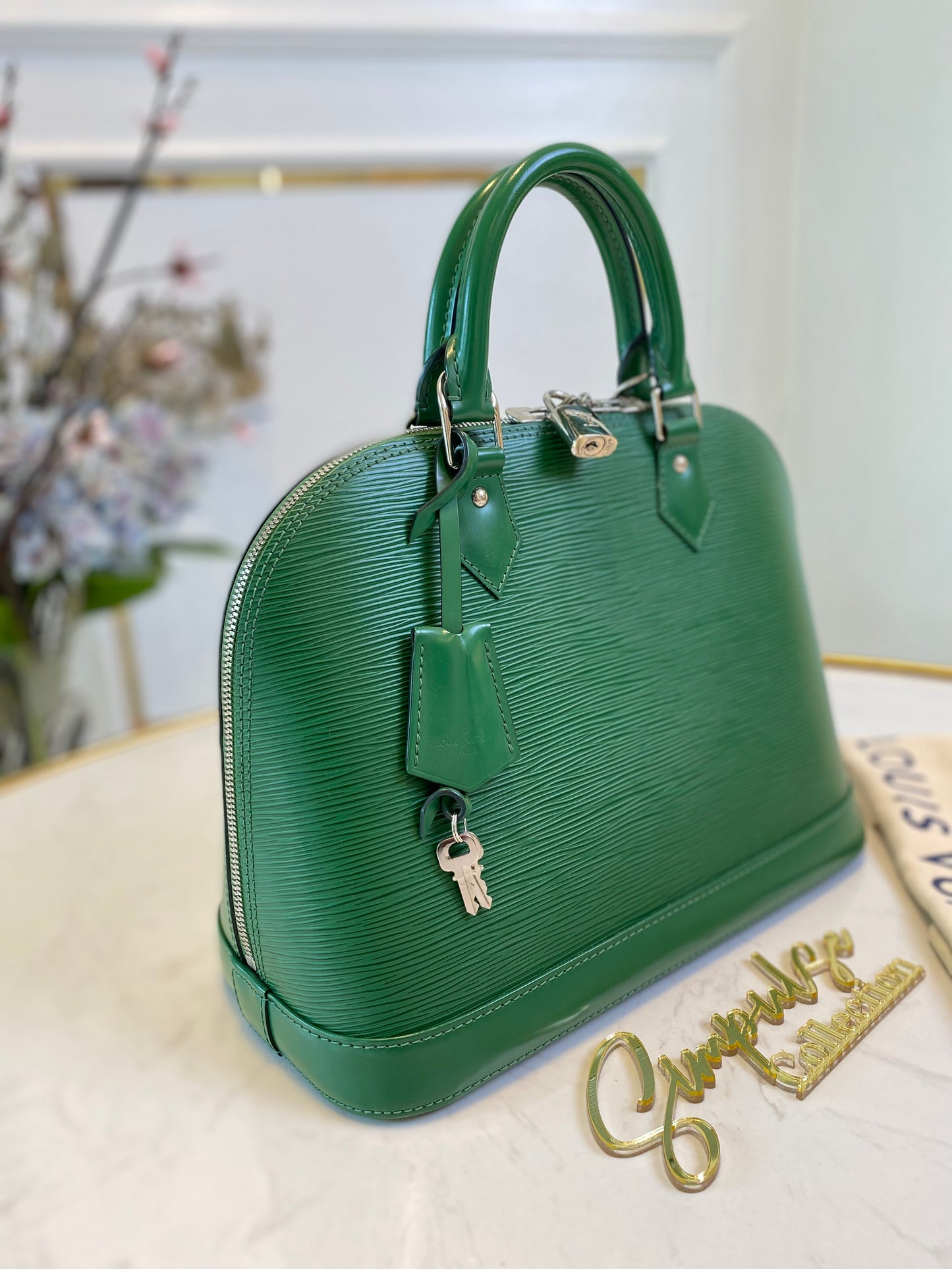 L V Menthe Epi Leather Alma
