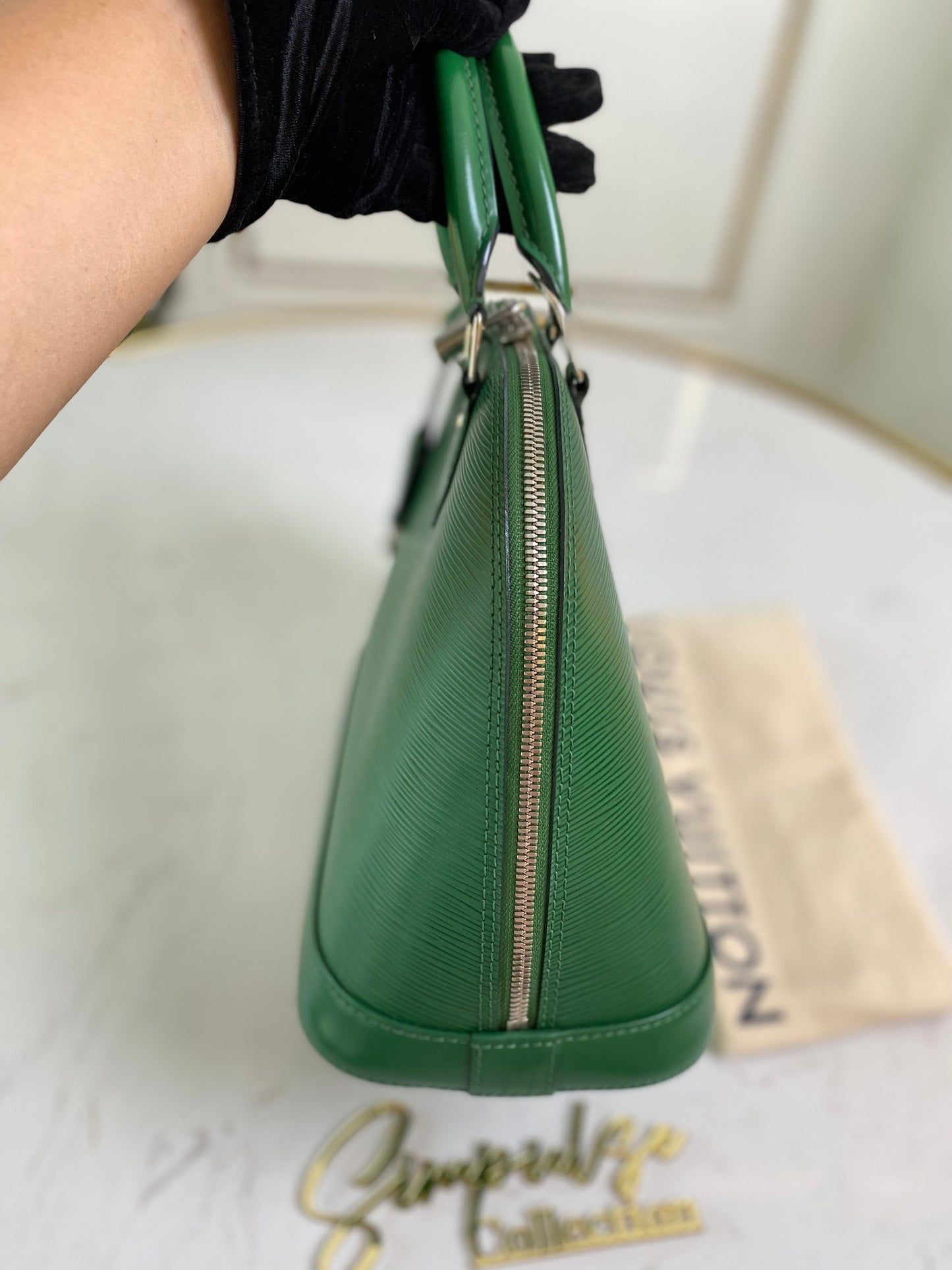 L V Menthe Epi Leather Alma