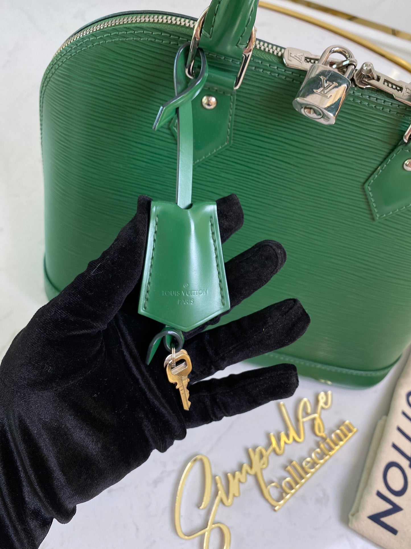 L V Menthe Epi Leather Alma