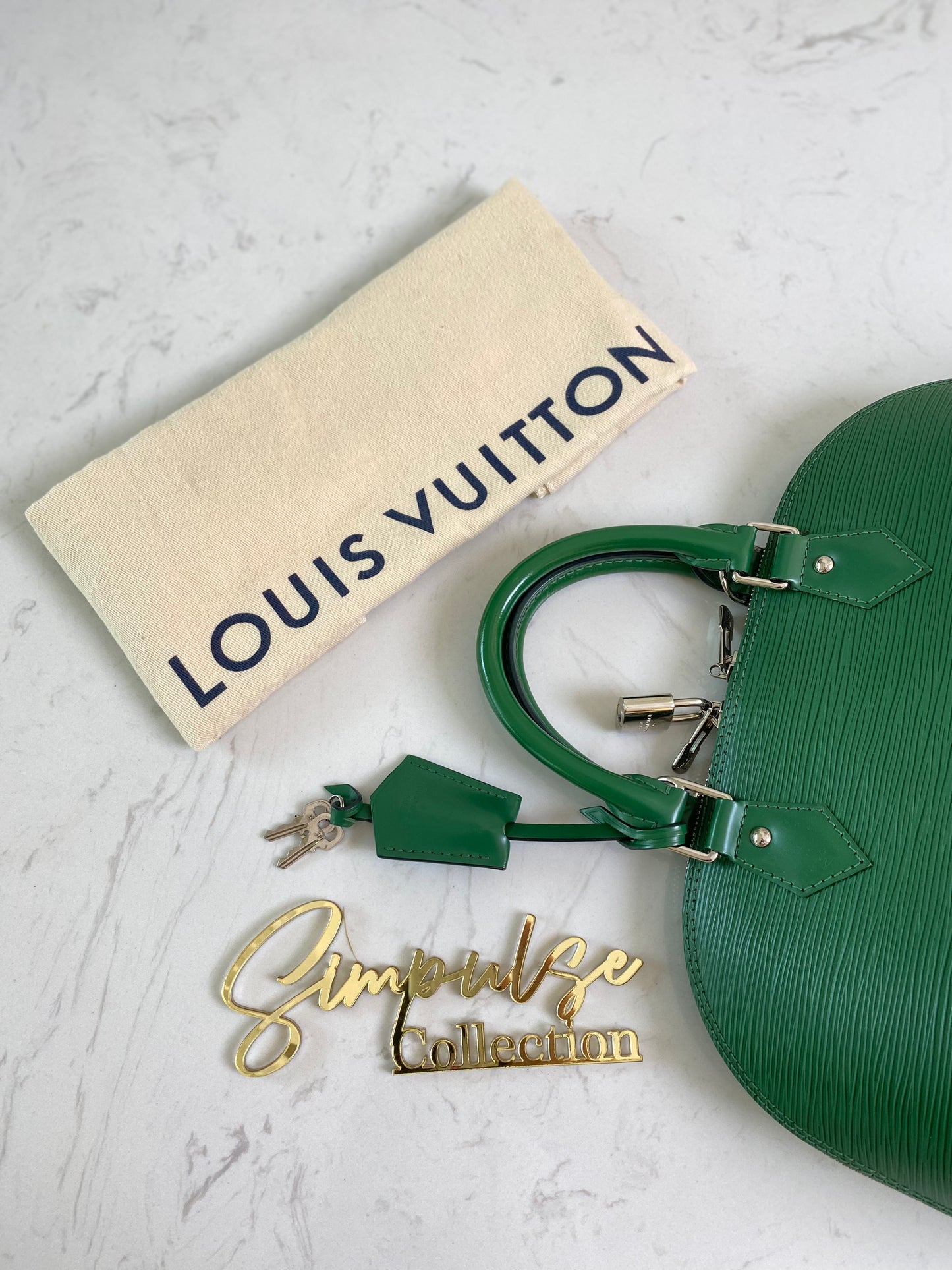 L V Menthe Epi Leather Alma