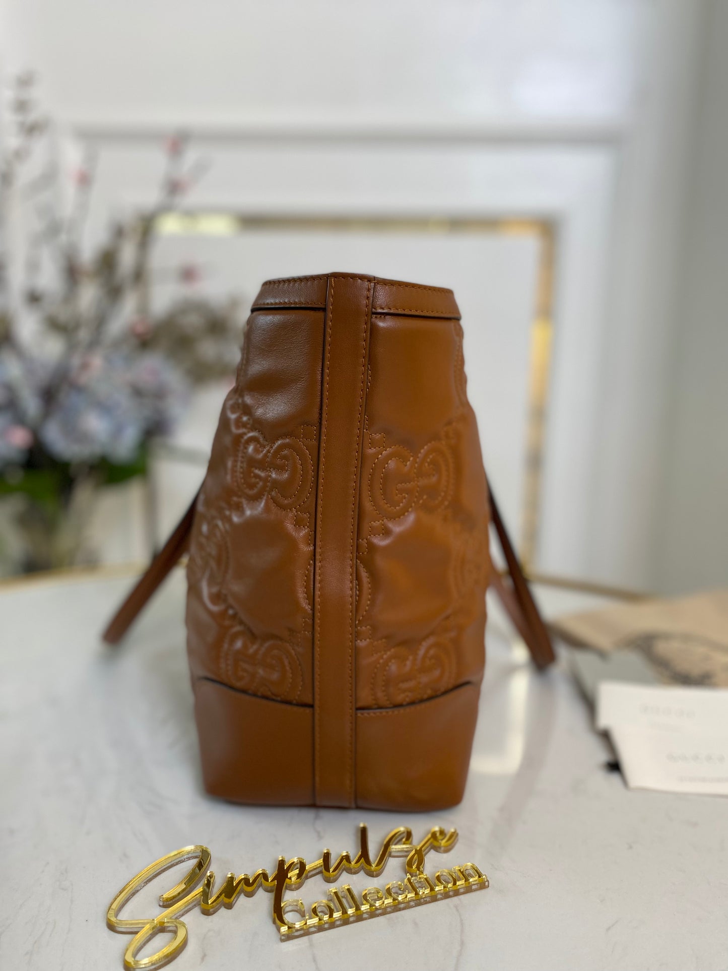 GG EMBOSSED MATELLASE BROWN SHOULDER TOTE