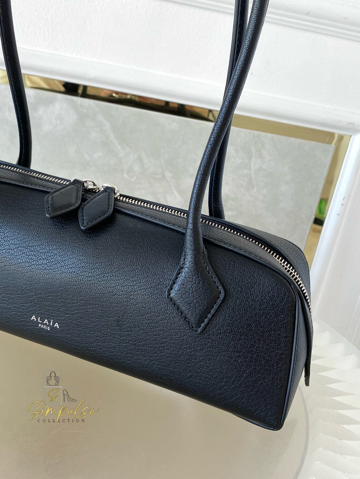 ALAIA LE TECKEL MEDIUM BAG IN GOATSKIN IN BLACK