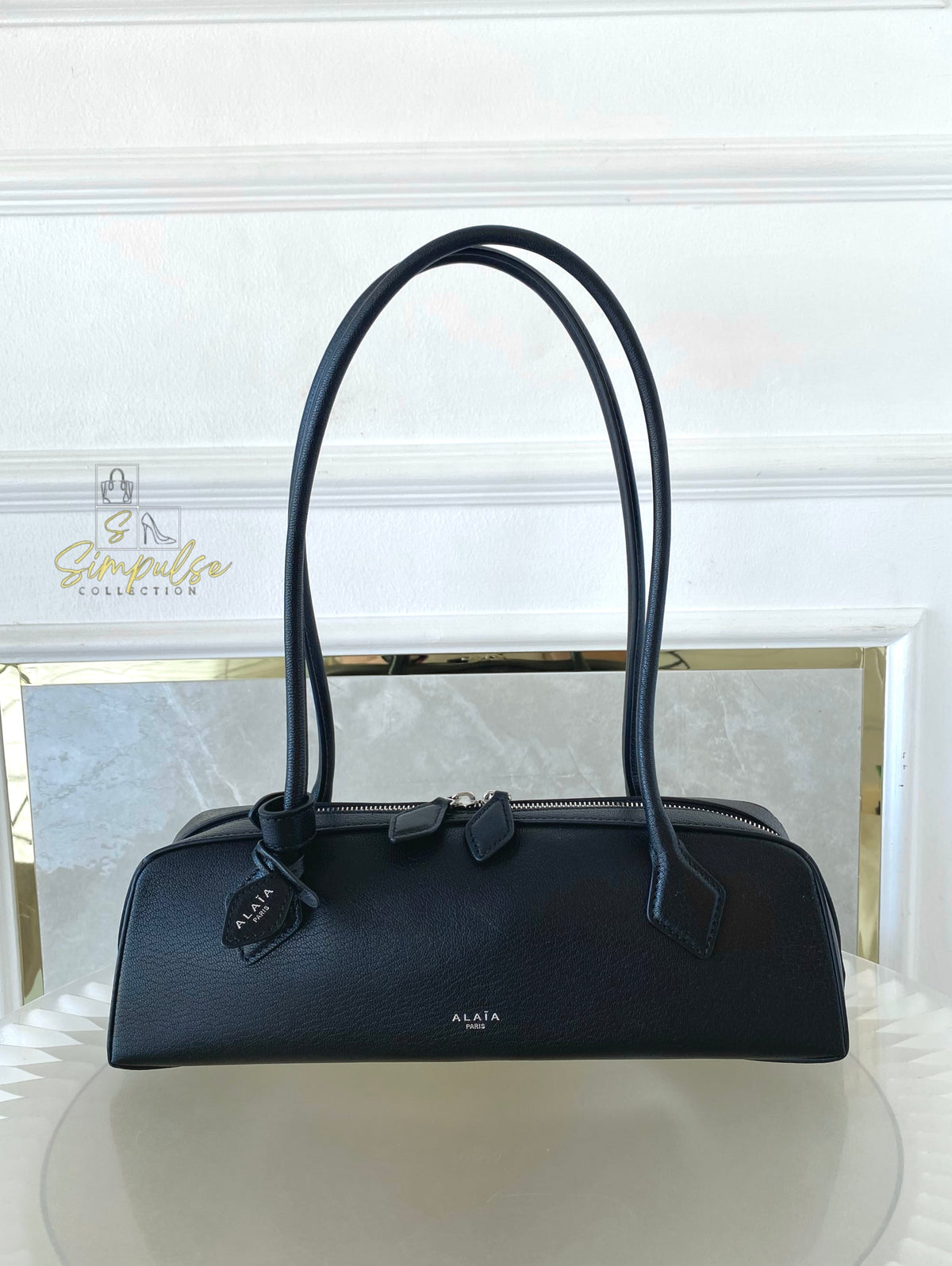 ALAIA LE TECKEL MEDIUM BAG IN GOATSKIN IN BLACK