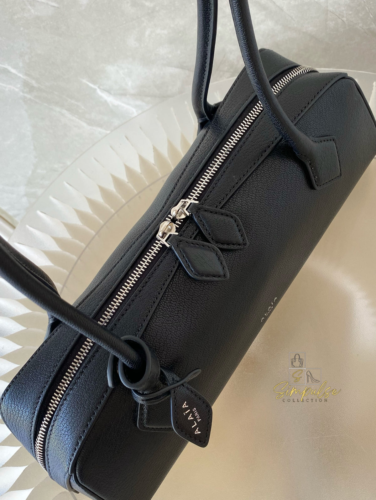 ALAIA LE TECKEL MEDIUM BAG IN GOATSKIN IN BLACK