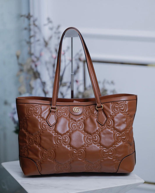 GG EMBOSSED MATELLASE BROWN SHOULDER TOTE