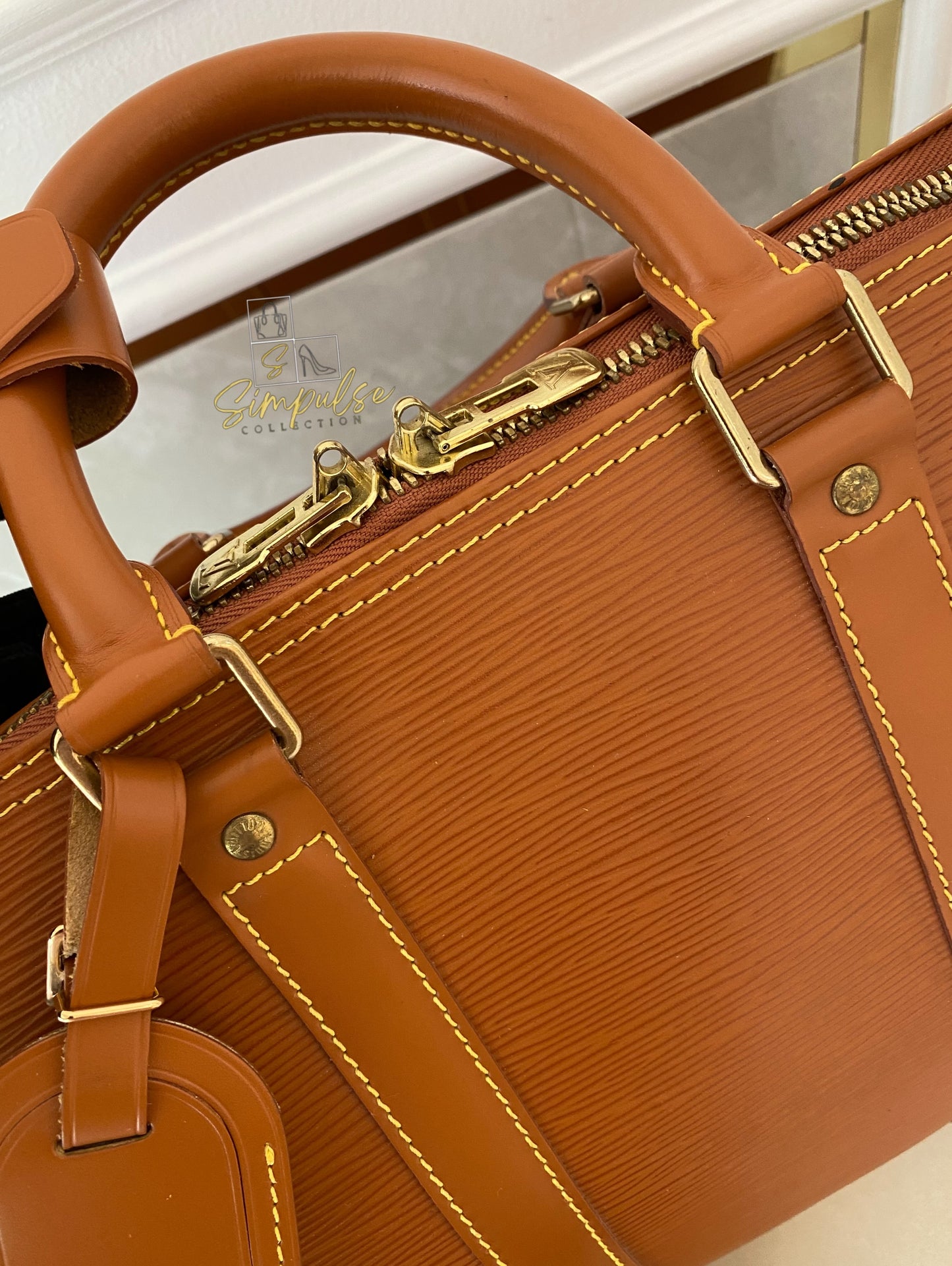 Louis Vuitton Keepall Epi Leather Cipango Gold