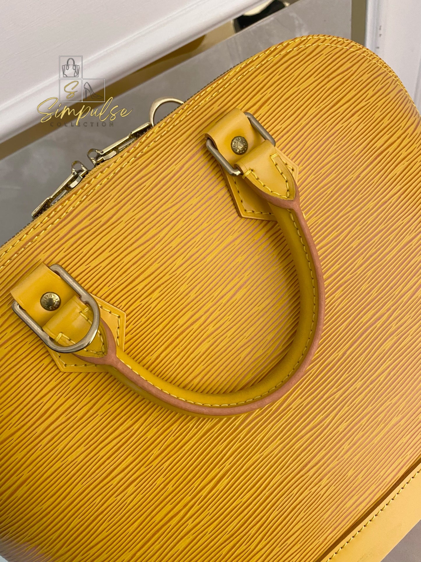 Louis Vuitton Epi Alma Bag Yellow