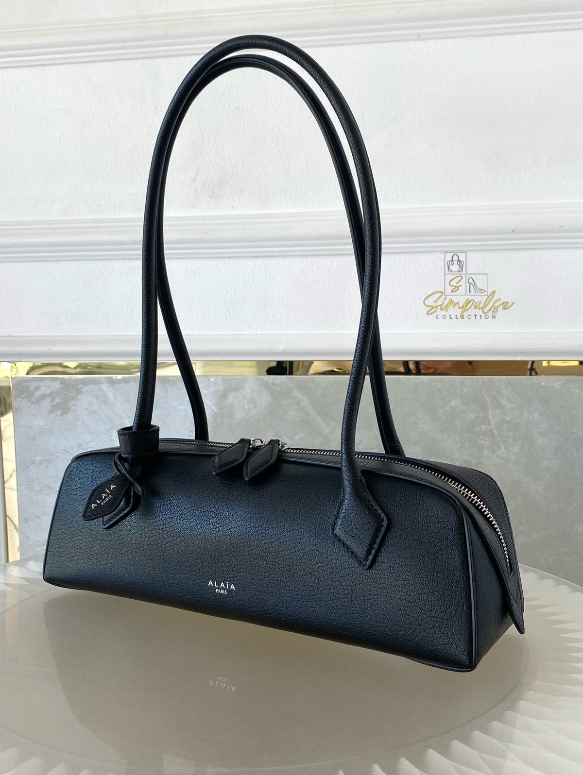ALAIA LE TECKEL MEDIUM BAG IN GOATSKIN IN BLACK