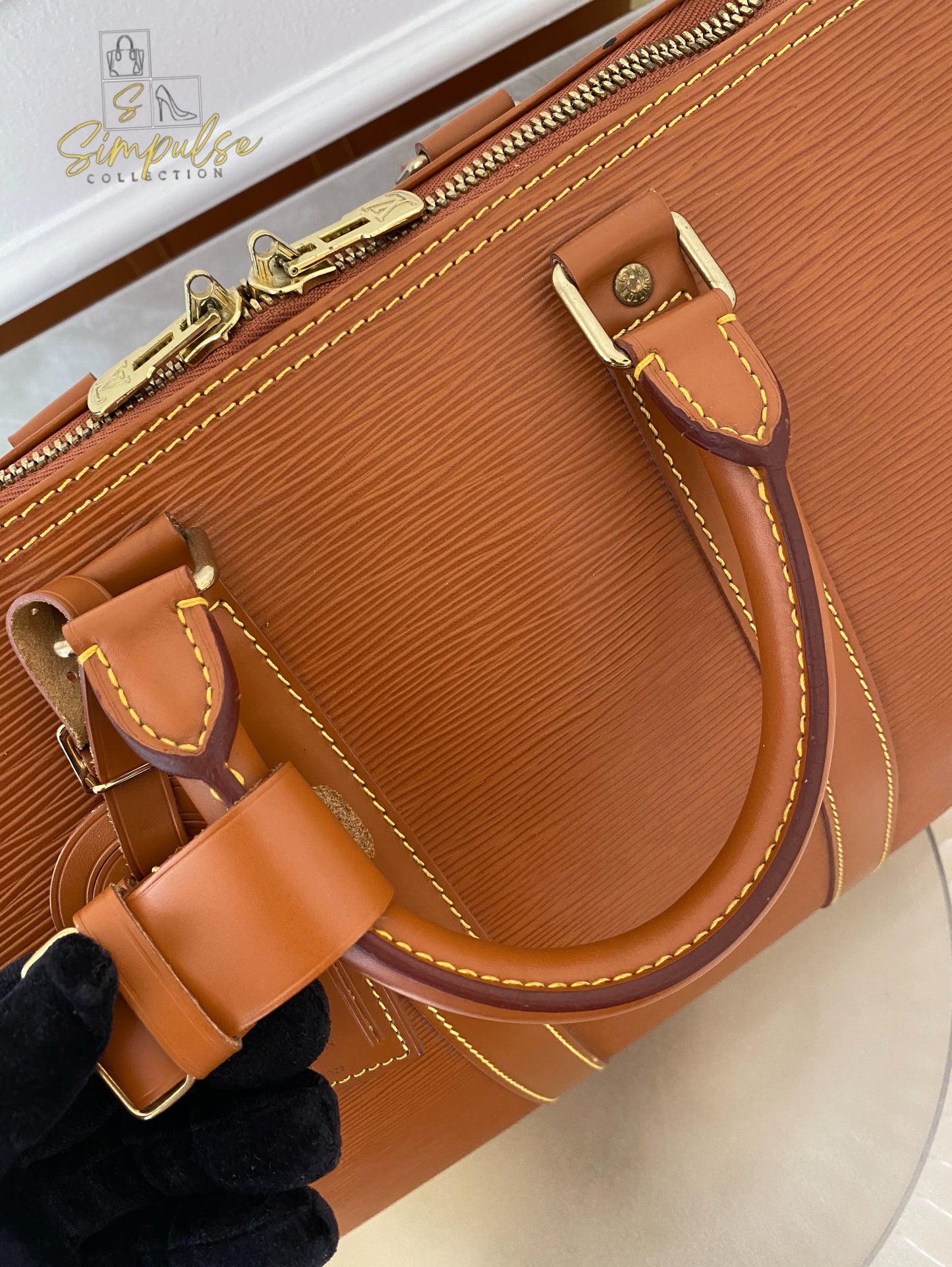 Louis Vuitton Keepall Epi Leather Cipango Gold