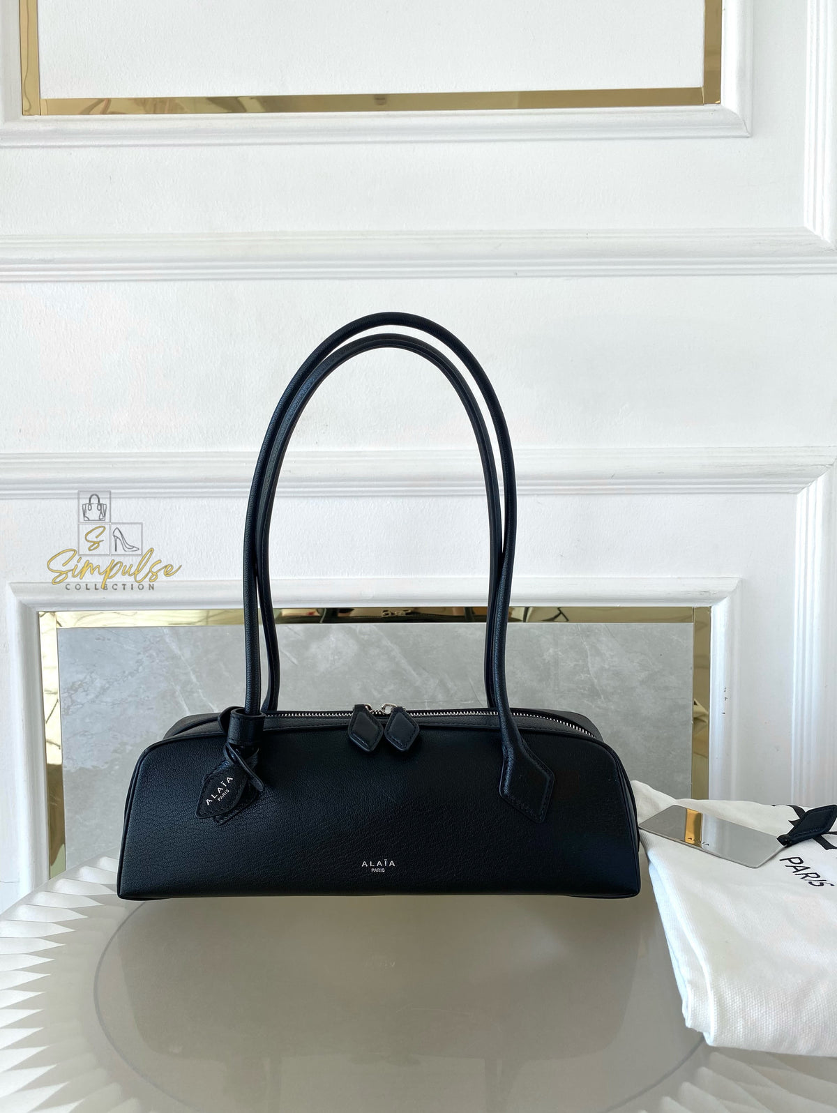 ALAIA LE TECKEL MEDIUM BAG IN GOATSKIN IN BLACK