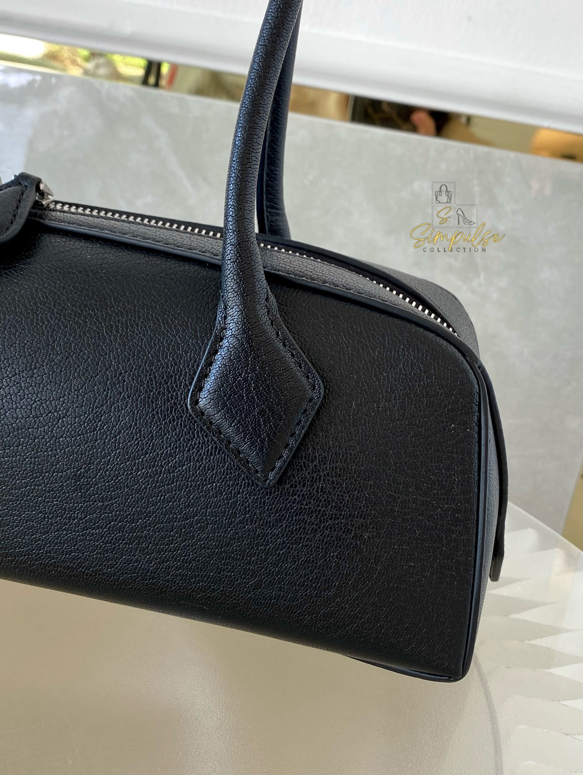 ALAIA LE TECKEL MEDIUM BAG IN GOATSKIN IN BLACK