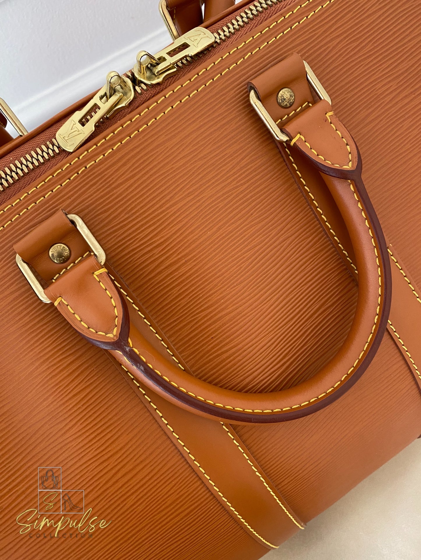 Louis Vuitton Keepall Epi Leather Cipango Gold
