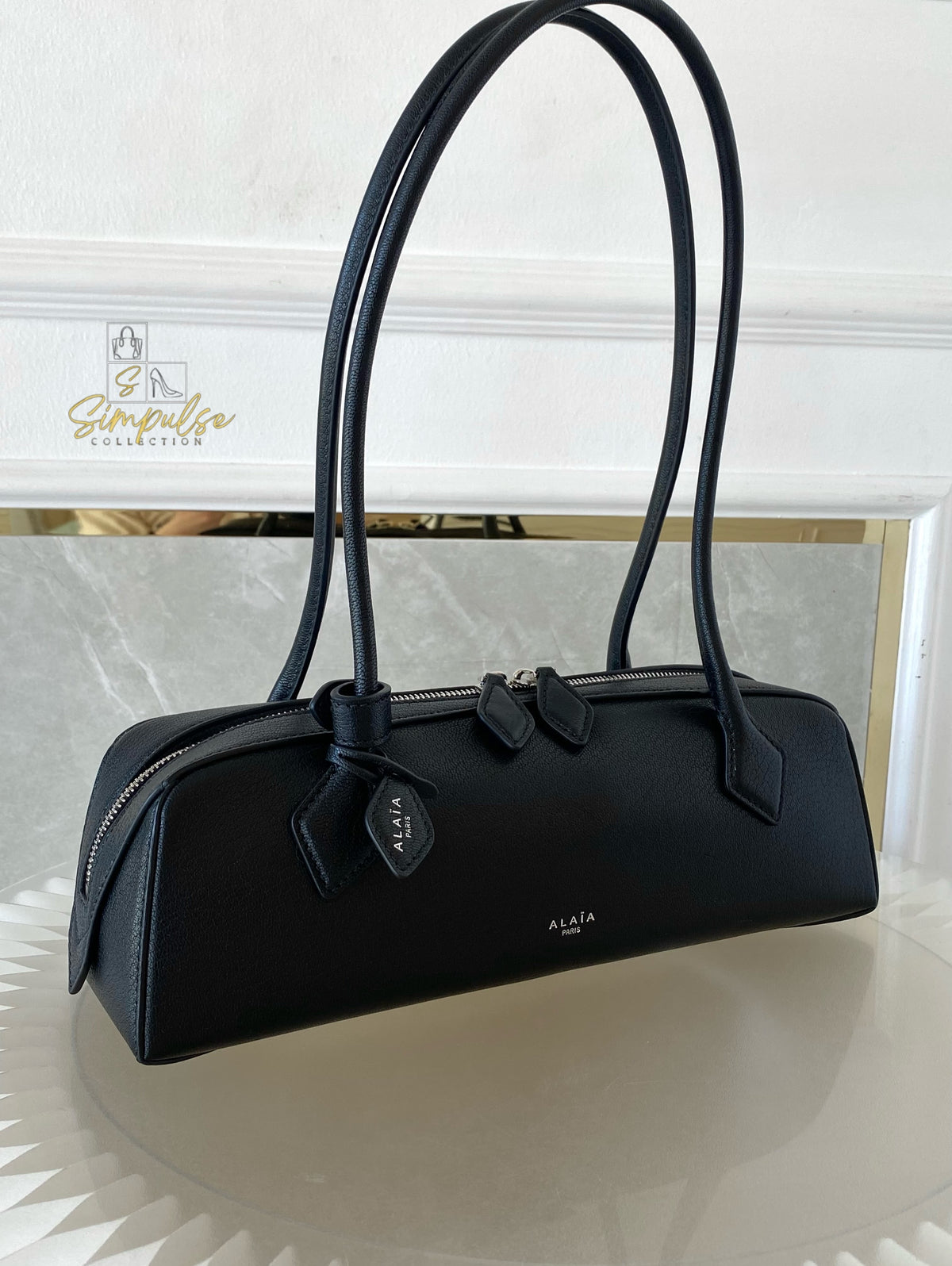 ALAIA LE TECKEL MEDIUM BAG IN GOATSKIN IN BLACK