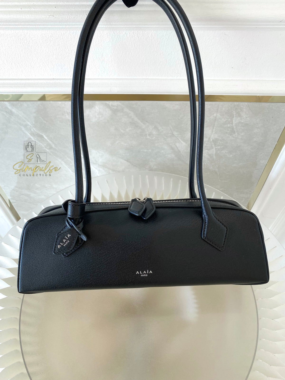 ALAIA LE TECKEL MEDIUM BAG IN GOATSKIN IN BLACK
