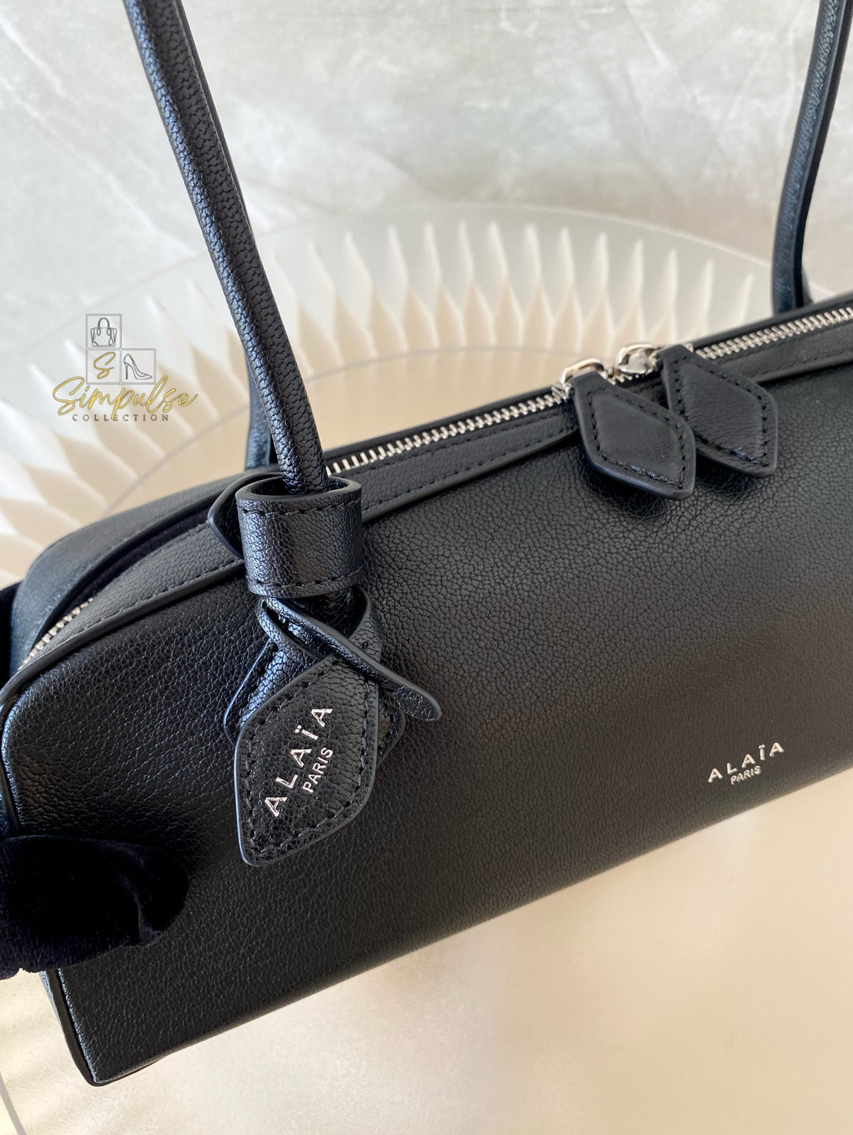 ALAIA LE TECKEL MEDIUM BAG IN GOATSKIN IN BLACK