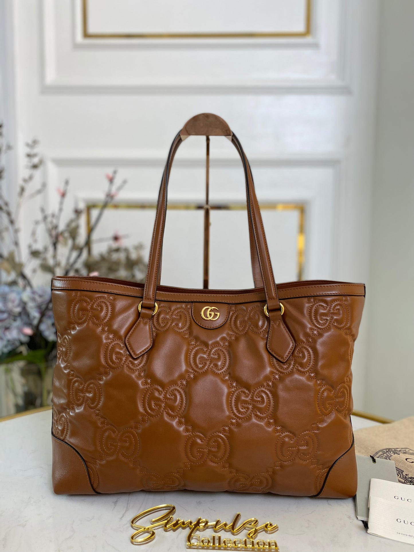 GG EMBOSSED MATELLASE BROWN SHOULDER TOTE