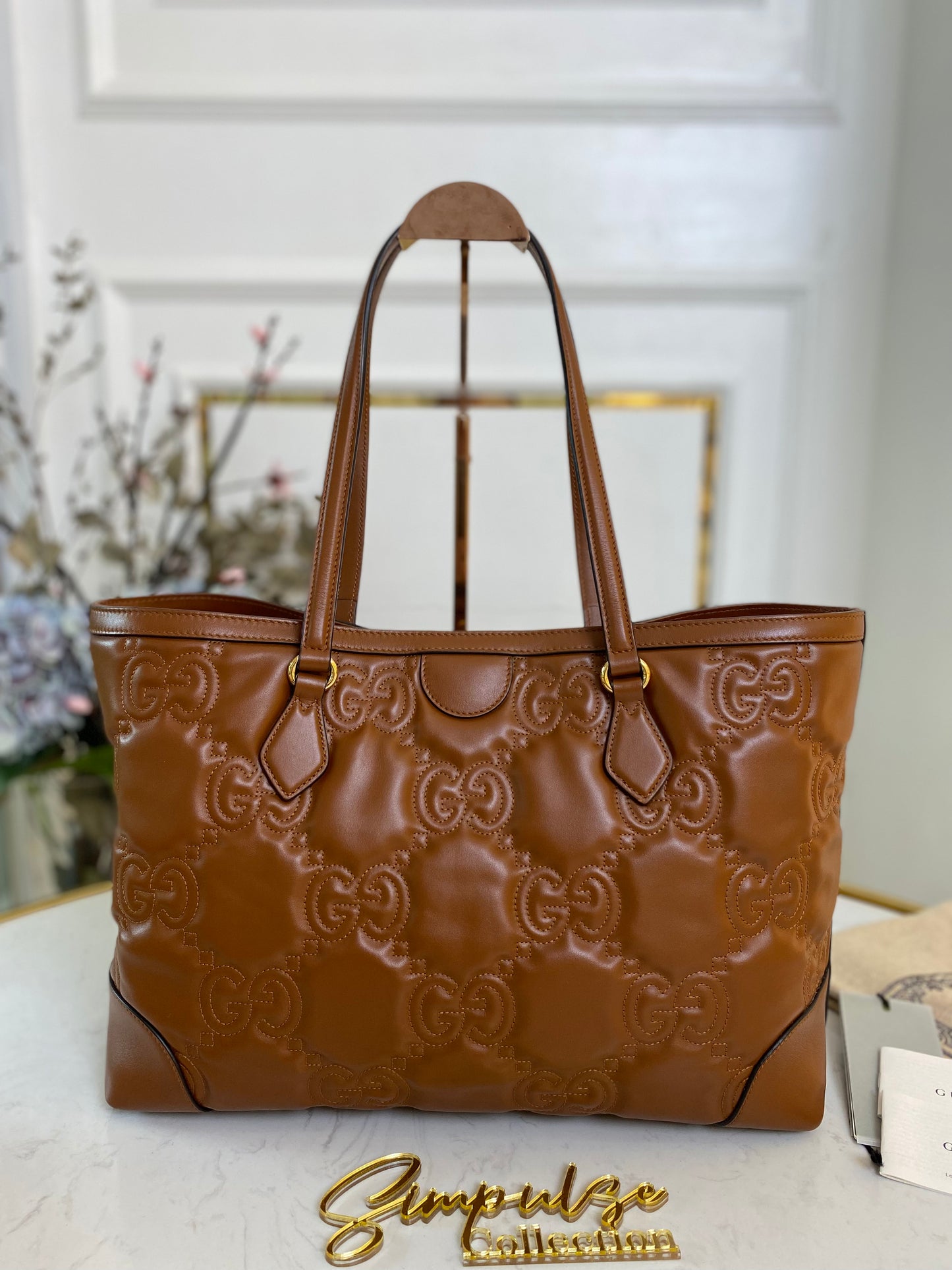 GG EMBOSSED MATELLASE BROWN SHOULDER TOTE